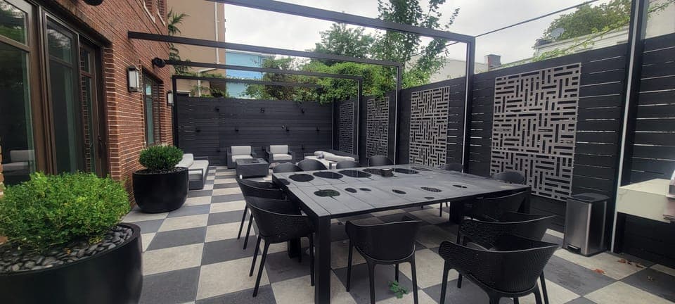 Checkerboard Patio Garden — Dining table under the pergola