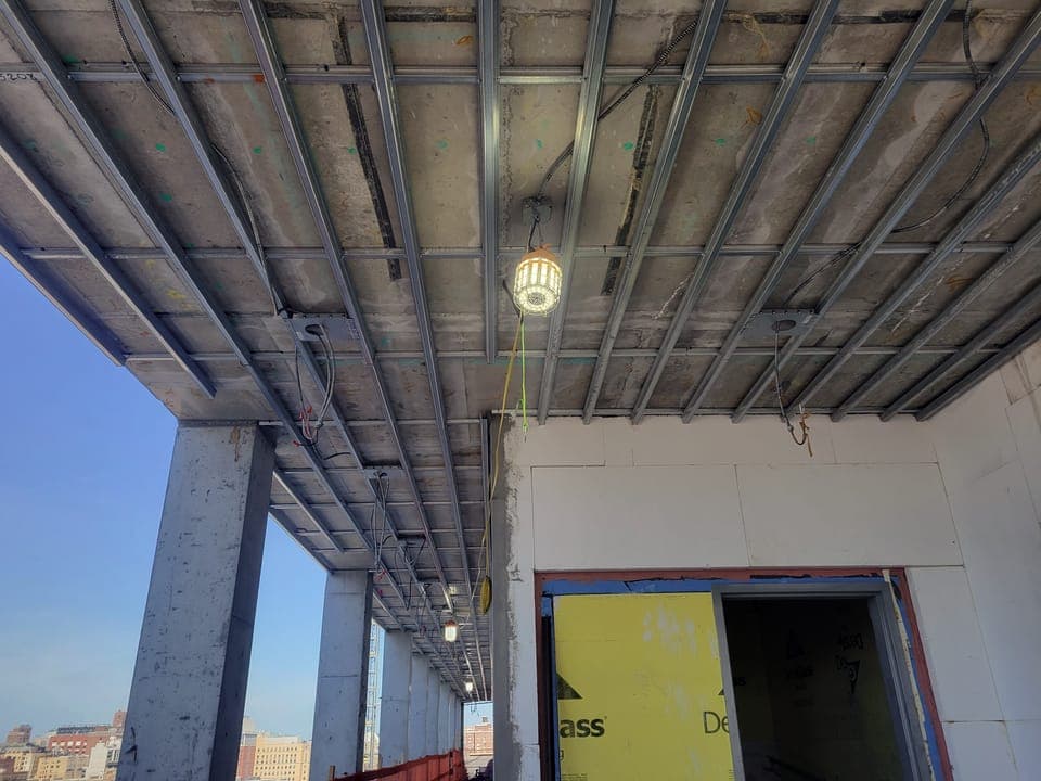 Suspended Wood Soffit — Steel ceiling framing in progress