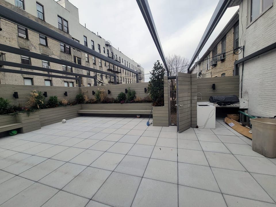 Crown Heights Rooftop — Wide terrace with outdoor kitchen
