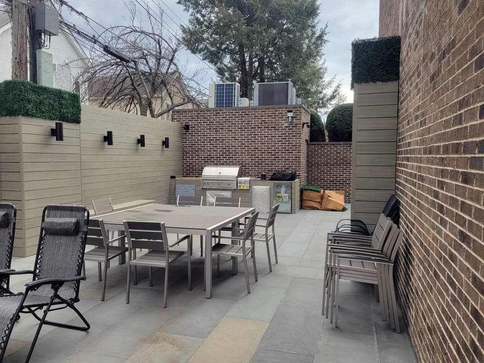 Brick-Walled Backyard — Brick kitchen and dining area