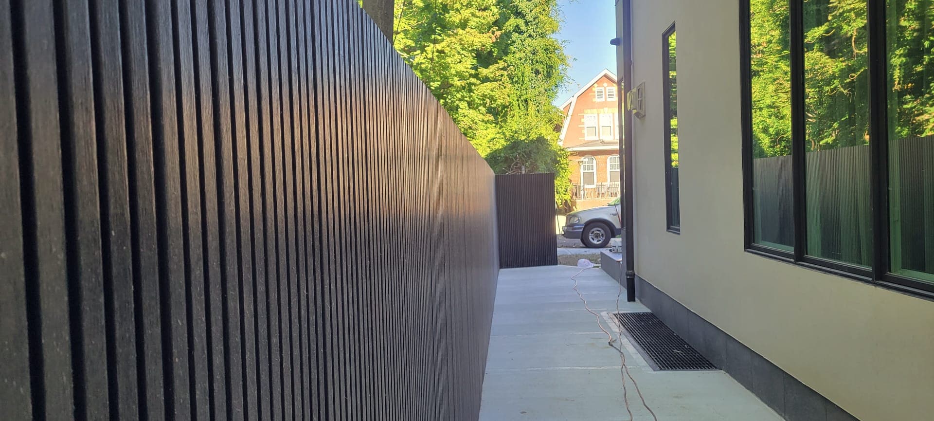Dark Slat Privacy Screen — after: Finished dark slat fence