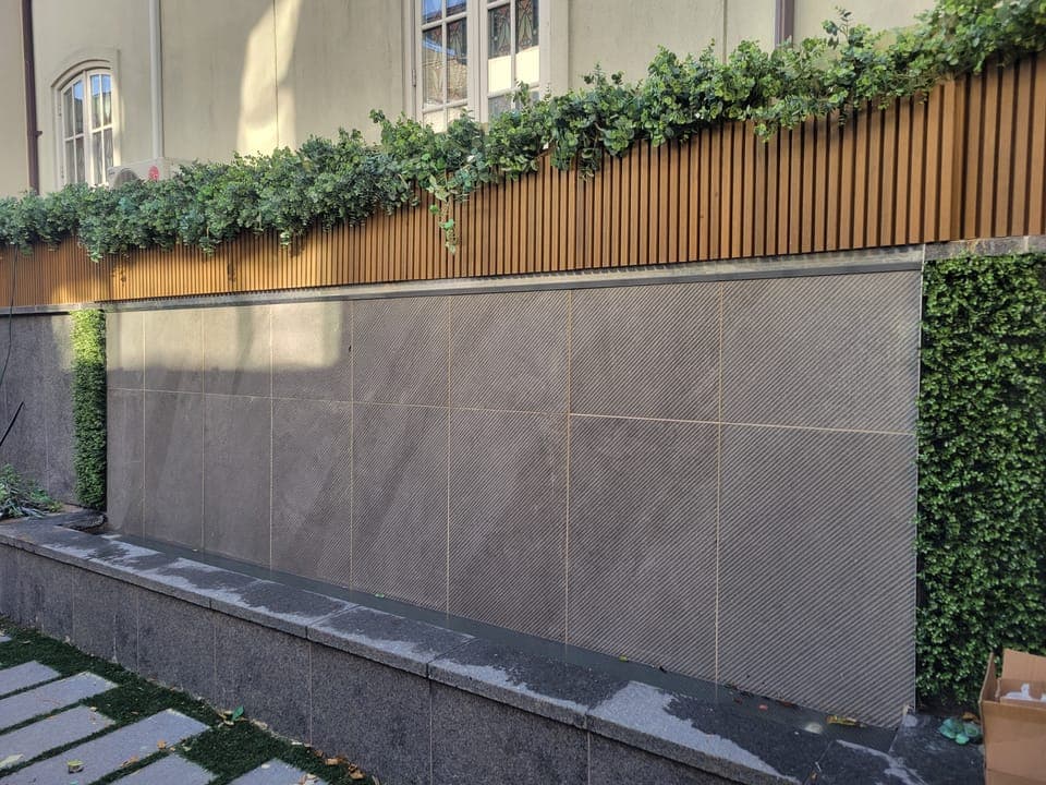Selected Work — Porcelain facade with planted greenery