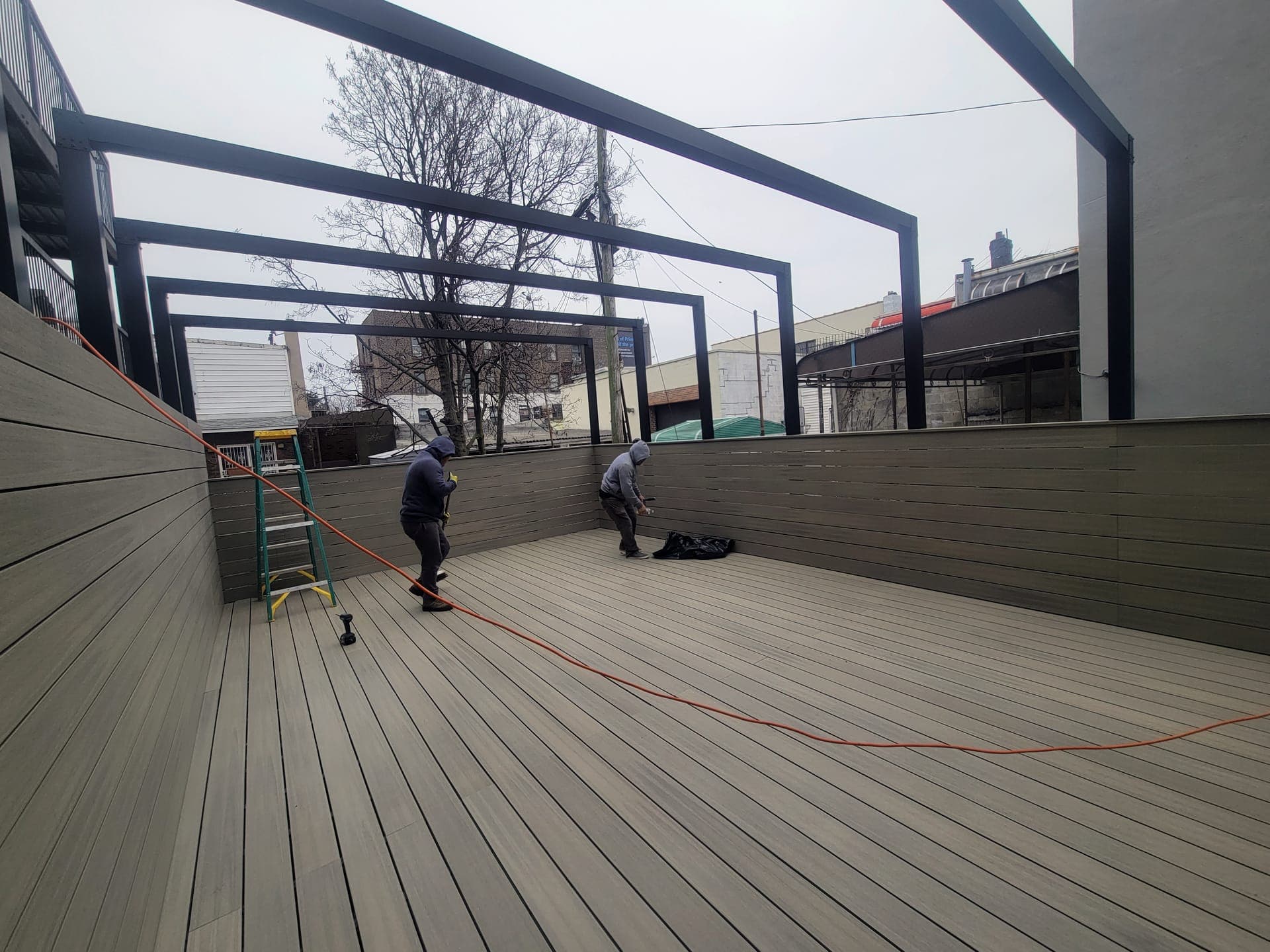 Sunset Park Rooftop Kitchen — Long deck view toward the grills