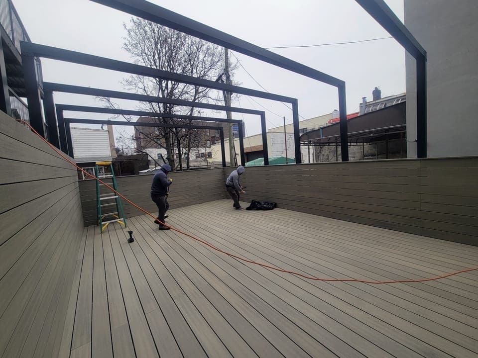 Sunset Park Rooftop Kitchen — Long deck view toward the grills