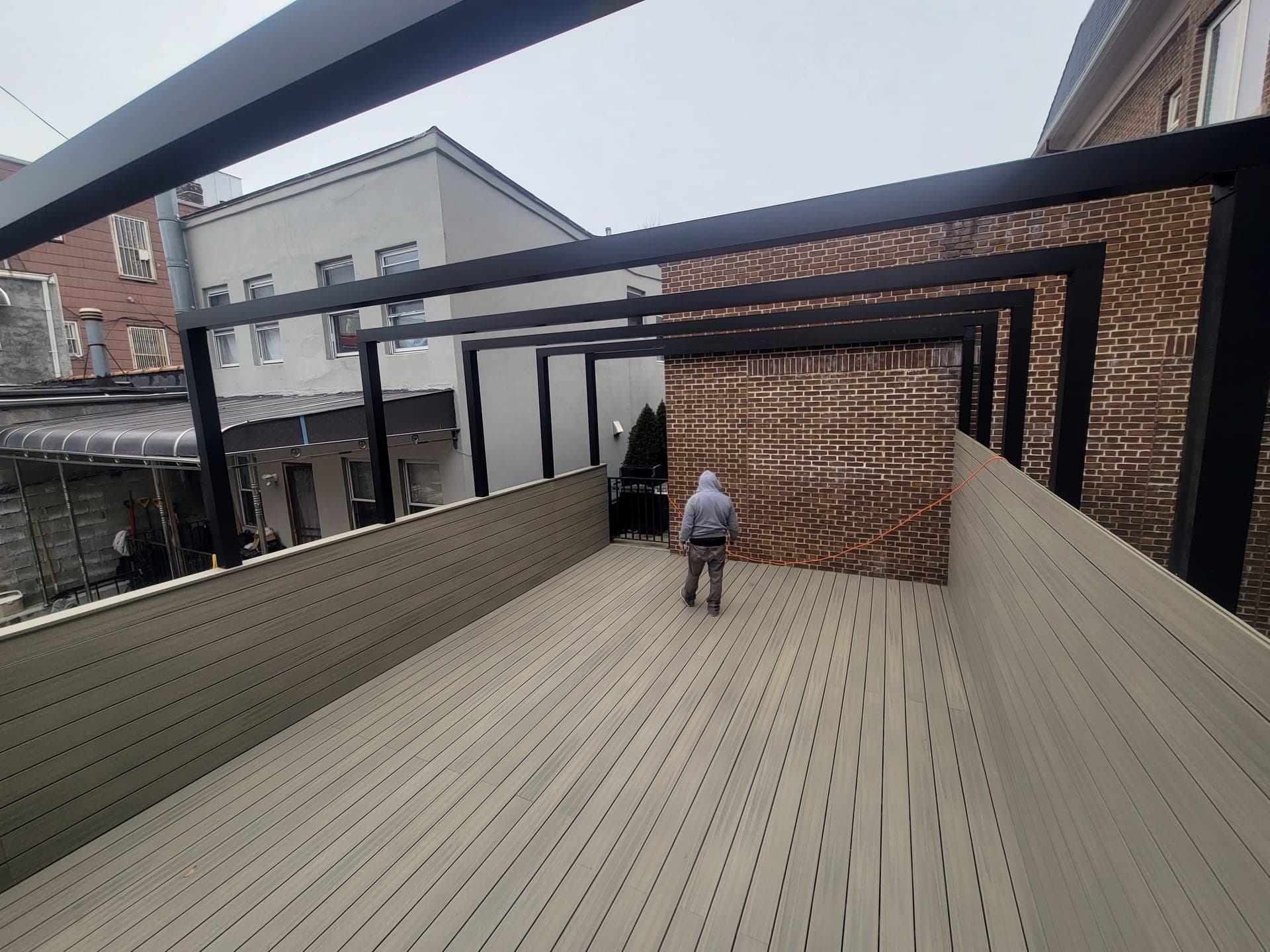 Sunset Park Rooftop Kitchen — Deck kitchen and dining, lit at night