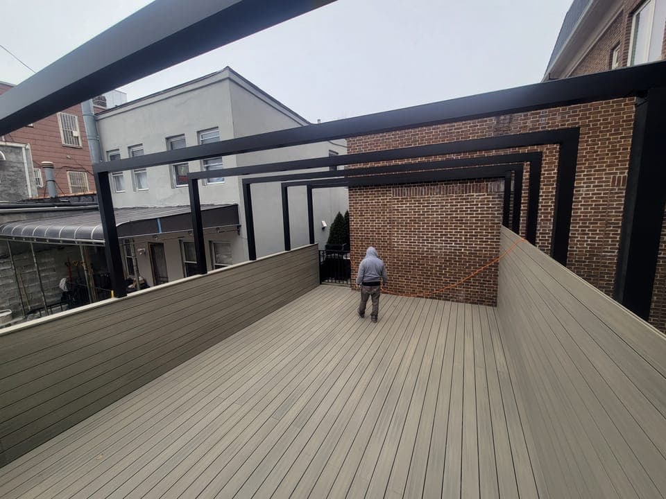 Sunset Park Rooftop Kitchen — Kitchen and dining lit at night